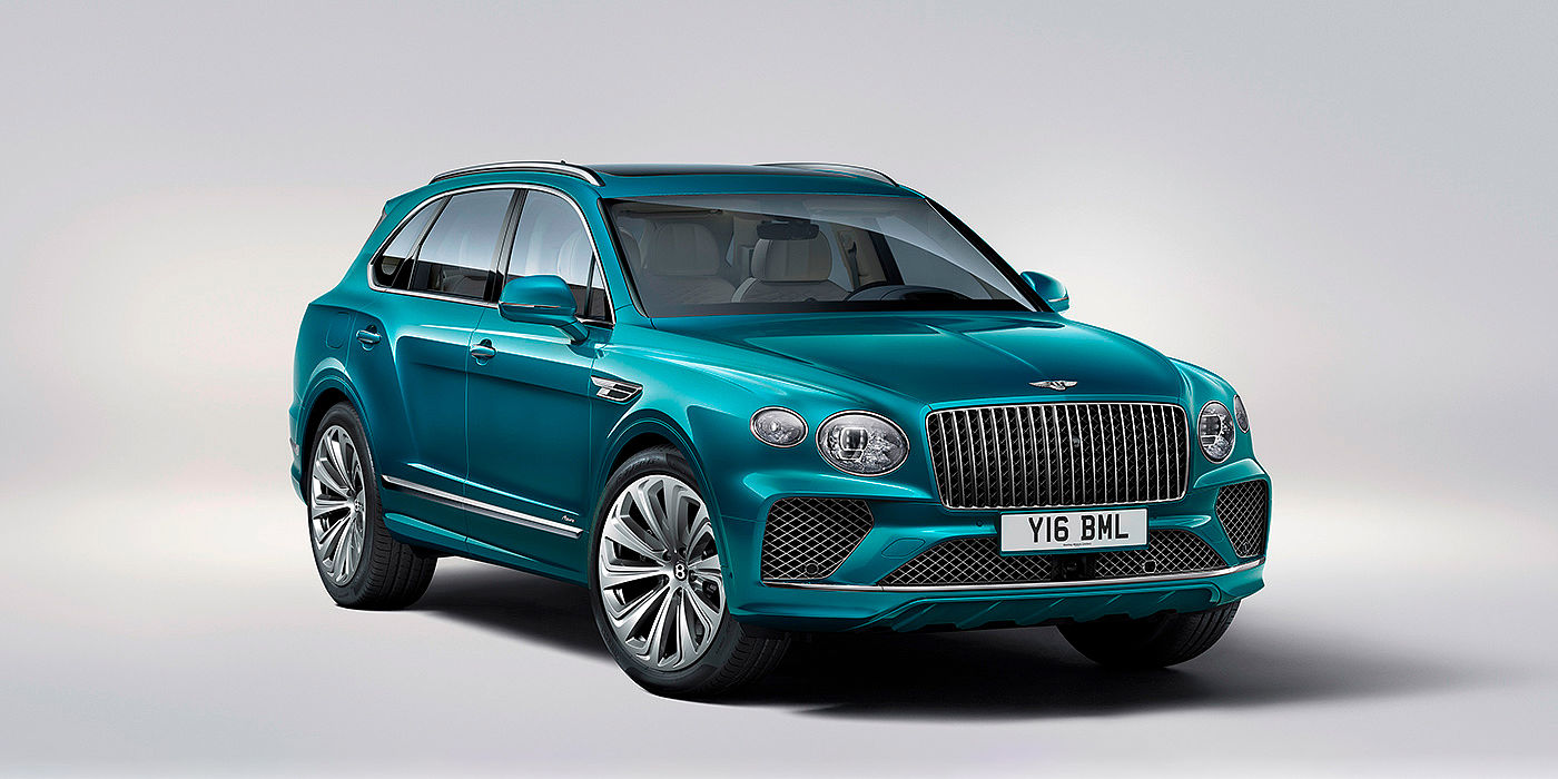 Bentley Firenze Bentley Bentayga Azure front three-quarter view, featuring a fluted chrome grille with a matrix lower grille and chrome accents in Topaz blue paint.