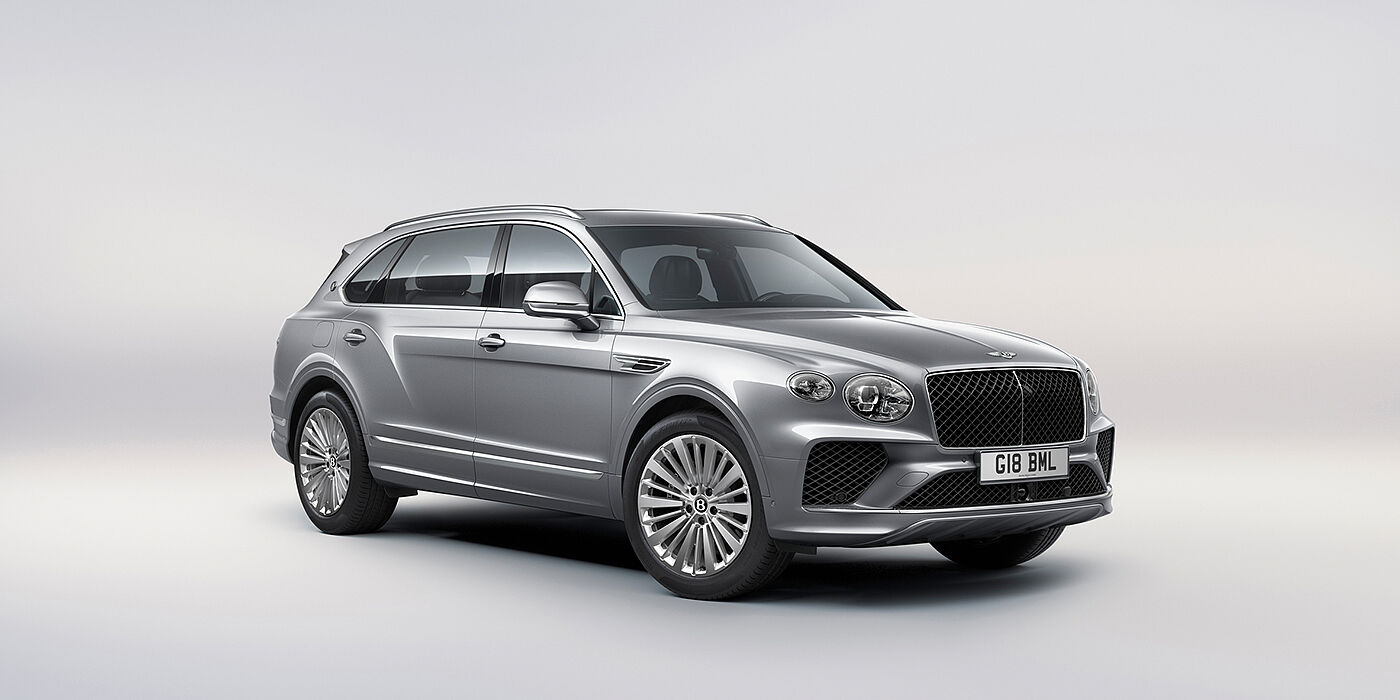 Bentley Firenze Bentley Bentayga Extended Wheelbase luxury SUV front three quarter view in Moonbeam paint with 21 inch five spoke painted wheels