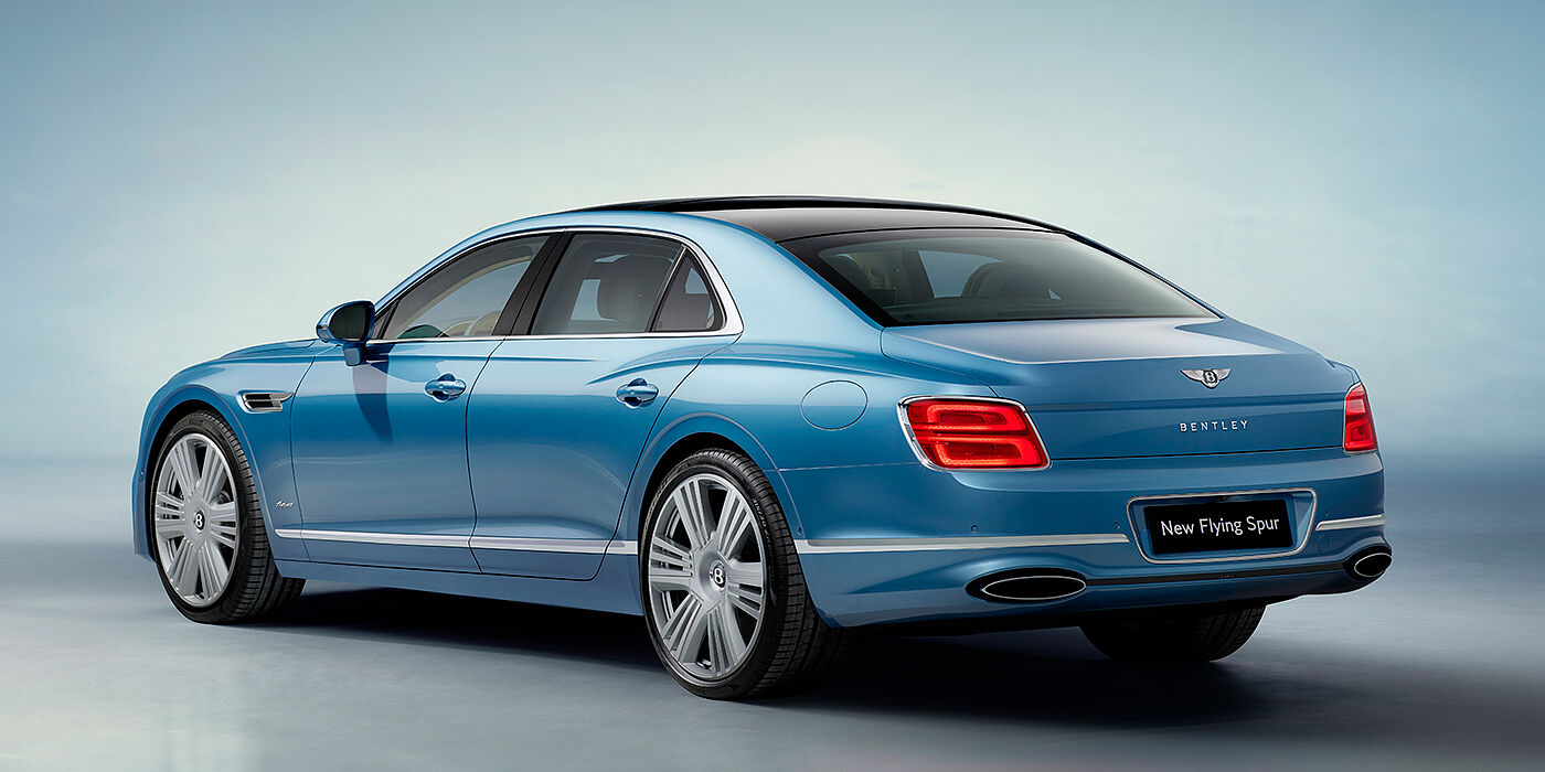Bentley Firenze New Bentley Flying Spur Azure sedan rear view in Light windsor blue by Mulliner paint with 22 inch Azure wheels and chrome exterior details