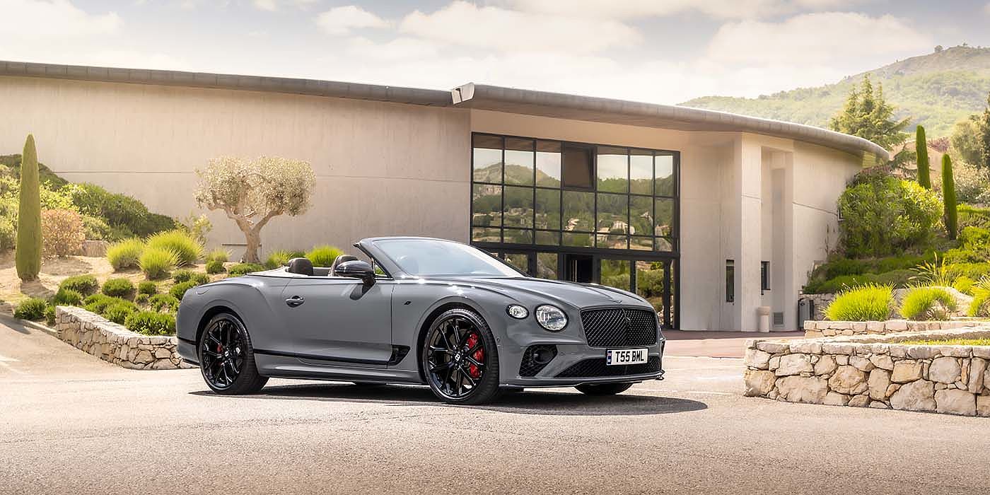 Bentley Firenze Bentley Continental GTC S convertible in Cambrian Grey paint front 34 static near house