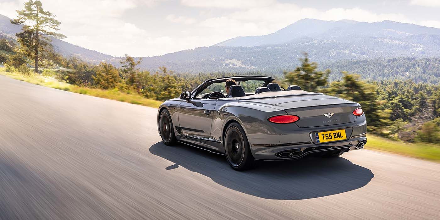 Bentley Firenze Bentley Continental GTC S convertible in Cambrian Grey paint rear 34 dynamic driving