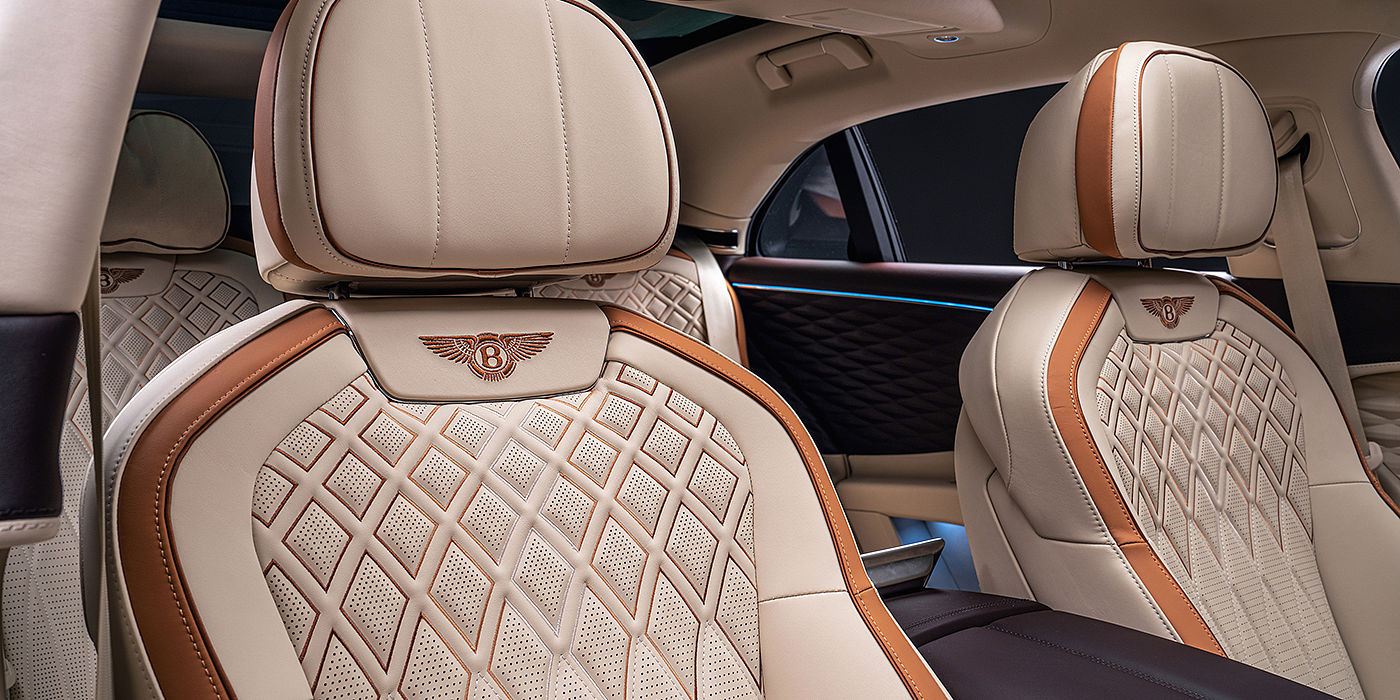 Bentley Firenze Bentley Flying Spur Odyssean sedan rear seat detail with Diamond quilting and Linen and Burnt Oak hides