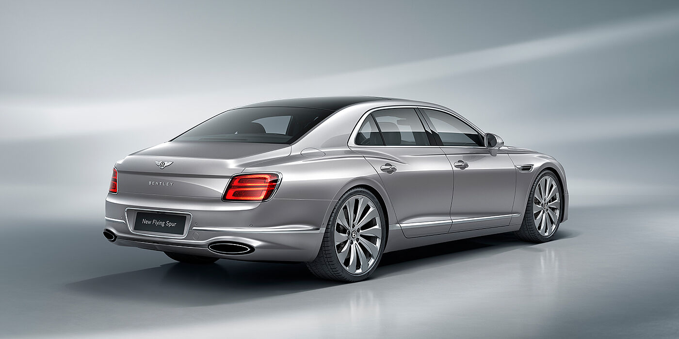 Bentley Firenze New Bentley Flying Spur sedan rear view in Silverlake paint with ten spoke wheels and chrome matrix grille