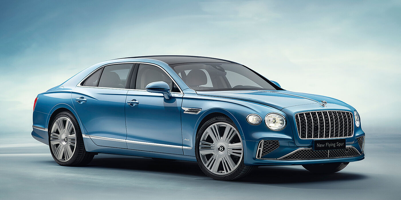 Bentley Firenze New Bentley Flying Spur Azure sedan front view in Light windsor blue by Mulliner paint with 22 inch Azure wheels and chrome exterior details