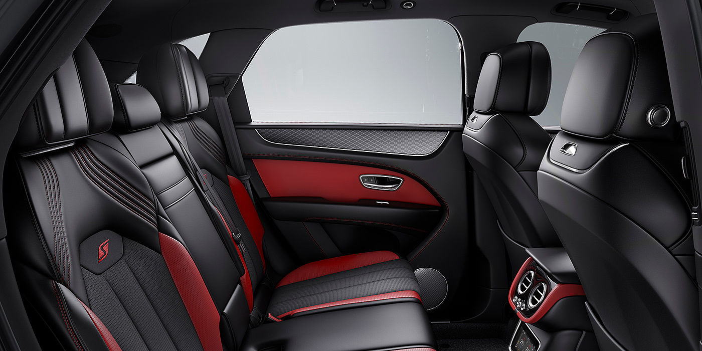 Bentley Firenze Bentey Bentayga S interior view for rear passengers with Beluga black and Hotspur red coloured hide.