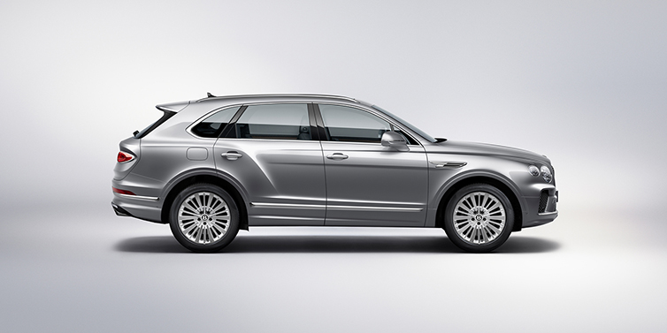 Bentley Firenze Bentley Bentayga SUV side profile in Moonbeam silver paint against white background featuring 21 inch 5 spoke wheels
